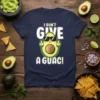 I DON'T GIVE A GUAC! text with a sunglasses-wearing avocado giving the middle finger graphic on a navy t-shirt