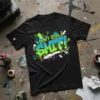 Black t-shirt with "I DON'T GIVE A SHIT!" in vibrant green and blue graffiti style lettering and splatters