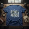 I Don't Know t-shirt with vintage compass and gear graphic, white distressed text on blue tee