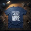 Navy blue t-shirt with white distressed text "I DON'T KNOW. I JUST WORK HERE." design, featuring a humorous workplace quote