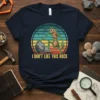 I Don't Like This Rock t-shirt design with a creature and retro sunset graphic