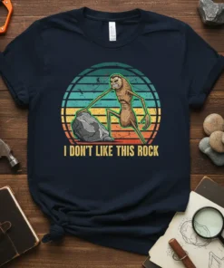 I Don't Like This Rock t-shirt design with a creature and retro sunset graphic