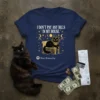 Navy blue t-shirt with gold text "I DON'T PAY ANY BILLS IN MY HOUSE" above a black pharaoh cat on