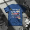 Blue t-shirt with white and yellow text: "I DON'T THINK BEFORE I SPEAK I LIKE TO BE JUST AS SURPRISED