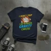I DON'T TRIP I DO RANDOM GRAVITY CHECKS text on a navy t-shirt with a graphic of a person falling