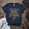 I DON'T TRUST STAIRS... THEY'RE ALWAYS UP TO SOMTHING quote on a navy blue t-shirt with golden yellow distressed font