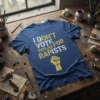 Blue t-shirt with bold yellow and white text "I DON'T VOTE FOR RAPISTS" and a raised fist graphic