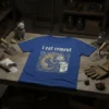 I Eat Cement t-shirt design featuring a dragon eating cement mix, with gothic font text above