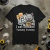 Funny cat eating cement quote "I eat cement Yummy Yummy" on a black t-shirt, muscular cat holding cement bags