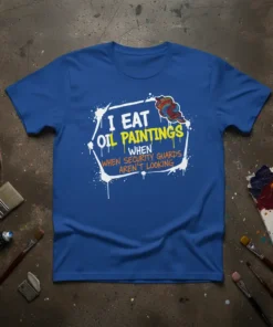 I Eat Oil Paintings When Security Guards Aren't Looking humorous quote on a blue t-shirt, art supplies in background