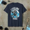 I FEELING FERAL text with a raccoon playing hockey on a blue circle background, t-shirt design