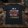 Navy t-shirt with "I'm A Mekanik Mechanick Mecanic ... I Fix Boats" text, humorously correcting spellings to highlight boat repair