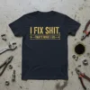 Navy blue t-shirt with gold text "I FIX SHIT. THAT'S WHAT I DO." featuring wrench graphics, designed for mechanics
