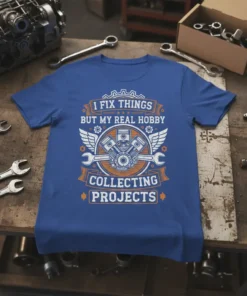 T-shirt with the text "I Fix Things But My Real Hobby Collecting Projects" and a graphic of a V8 engine