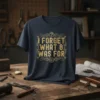 I Forget What 8 Was For quote in distressed gold font on a navy blue t-shirt. Includes question mark and