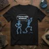 I Found This Humerus funny skeleton pun t-shirt with blue glowing skeletons and text in a speech bubble