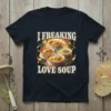 T-shirt with "I Freaking Love Soup" text and four bowls of various soups, spoons, and a fireplace graphic