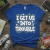 Blue t-shirt with white bold text "I GET US INTO TROUBLE" and yellow lightning bolt graphics, designed for partners in