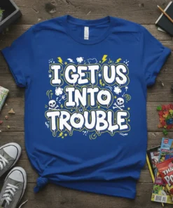 Blue t-shirt with white bold text "I GET US INTO TROUBLE" and yellow lightning bolt graphics, designed for partners in