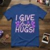 Blue t-shirt with white and purple glitter text saying "I GIVE Free HUGS!" surrounded by heart-shaped diamonds