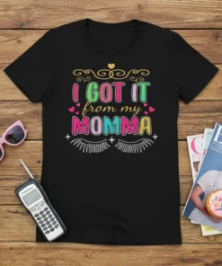 I Got It From My Momma text design with colorful lettering and decorative elements, on a black t-shirt
