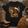 I Got My Boots On The Ground text with a cowgirl illustration, wings, and a boot graphic on a black
