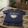 Navy t-shirt with "I Got New Teeth!" text above a cartoon smiling mouth with white teeth and sparkles