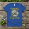Blue t-shirt with yellow text "I got that Frog in me" and a detailed circular graphic of a frog