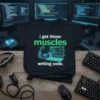 Black t-shirt with green text "i got these muscles writing code." featuring a robotic arm flexing next to a computer