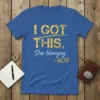 Blue t-shirt with yellow and light blue text reading "I GOT THIS. Stop Worrying. -GOD"