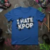 Bold white text "I HATE KPOP" with cracked texture and black starbursts on a blue t-shirt