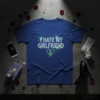 Blue t-shirt with "I HATE MY GIRLFRIEND" in neon green distressed font and a broken heart graphic