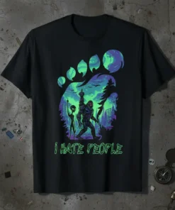 Bigfoot and alien giving middle fingers with "i HATE PEOPLE" text, set against a vibrant alien landscape backdrop