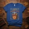 I Hate Pumpkin Spice text with steaming coffee cup graphic and autumn leaves design on a blue t-shirt