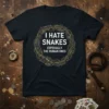 I HATE SNAKES ESPECIALLY THE HUMAN ONES quote on a black t-shirt, framed by a thorny vine wreath