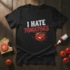 I Hate Tomatoes text design with an angry cartoon tomato graphic, available on a black t-shirt