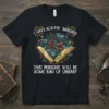 T-shirt featuring the quote "I Have Always Imagined That Paradise Will Be Some Kind of Library" with an open book