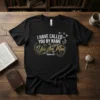 Christian t-shirt with "I HAVE CALLED YOU BY NAME You Are Mine ISAIAH 43:1" text and flying doves design