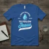Blue t-shirt with "I HAVE DECIDED TO FOLLOW Jesus" text and a diamond-like water drop graphic, scripture reference Matt. 28:19-20