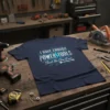 Navy t-shirt with "I Have Enough Power Tools Said No One Ever" text design featuring a lightning bolt and wrench