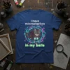 I have microplastics in my balls cat t-shirt with a tabby cat wearing goggles and glowing boots surrounded by swirling