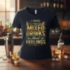 I Have Mixed Drinks About Feelings quote on a black t-shirt with cocktail shaker and lime graphics