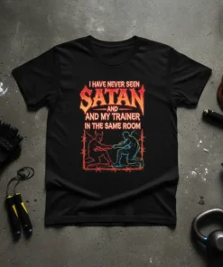 I Have Never Seen Satan And My Trainer In The Same Room quote on a black t-shirt, featuring graphic of