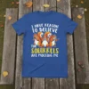 I HAVE REASON TO BELIEVE THE SQUIRRELS ARE MOCKING ME text with cartoon squirrels on a blue t-shirt