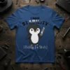 I HAVE STABILITY (Ability To Stab) text with a cute penguin holding a knife graphic on a blue t-shirt