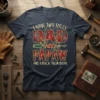 I Have Two Titles Dad And Papaw And I Rock Them Both quote on a navy t-shirt with plaid and