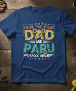 I Have Two Titles Dad and Papu And I Rock Them Both quote on a navy blue t-shirt, featuring distressed