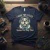 T-shirt with text "I HAVE TWO TITLES Gamer & Dog Dad" and a bulldog wearing headphones and holding a game