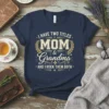 I Have Two Titles Mom & Grandma AND I ROCK THEM BOTH quote on a navy t-shirt with laurel wreath
