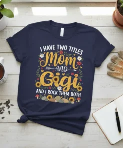 I HAVE TWO TITLES Mom AND Gigi AND I ROCK THEM BOTH text on a navy t-shirt with floral and
